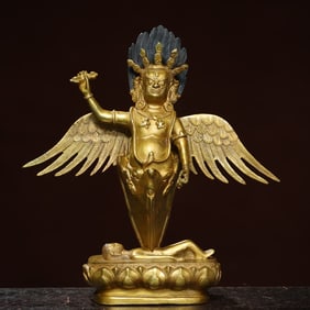 A bronze gilt greenhouse bird statue