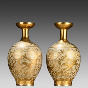 A pair of sterling silver gilt bottles with bird and animal prints