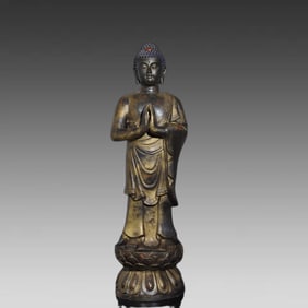 A piece of copper gold statue of the Buddha statue