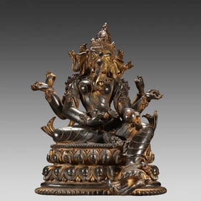 A bronze gilt statue of the elephant trunk god of the Qing Dynasty