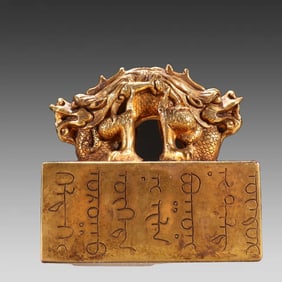 A Qing Dynasty bronze gilt dragon button seal