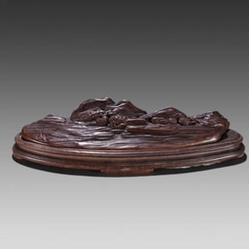 A Qing Dynasty agarwood carved landscape figure ornament