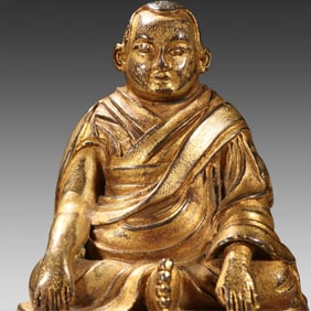A gilt bronze statue of the Guru Buddha