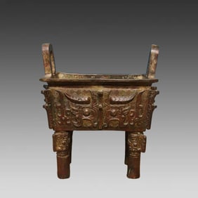 A bronze beast-faced square tripod