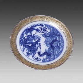 A piece of Qing Dynasty blue and white porcelain covered with gold and gilt two dragons in the sea