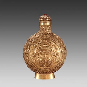 A Qing Dynasty copper-gilt eight-treasure pattern snuff bottle