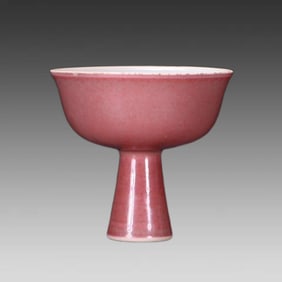 A Qing Dynasty red glazed goblet with auction catalogue