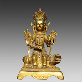 A bronze gilt statue of Manjushri Buddha