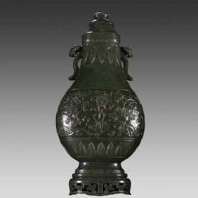 A Qing Dynasty Buddha Eight Treasures Ruyi amphora of Hetian Jasper