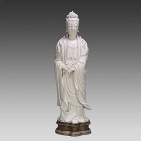 A Dehua white porcelain standing Guanyin statue