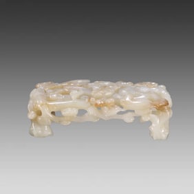 A Qing Dynasty Hetian jade carved flower and bird pattern ink bed