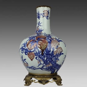 A blue and white glaze red nine peach picture inlaid with copper edge of the sky ball vase