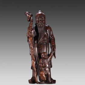 A Qing Dynasty agarwood birthday ornament