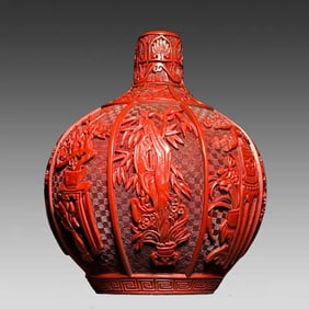 A piece of red lacquerware bottle