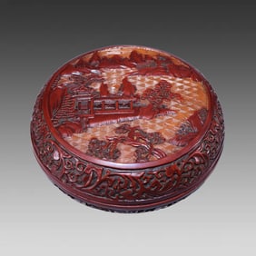 A piece of red lacquerware landscape box