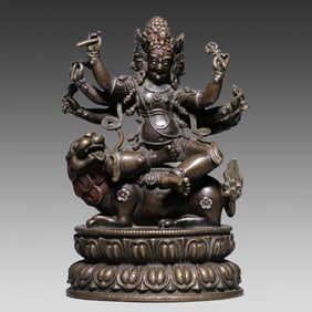 A Qing Dynasty alloy bronze inlaid six-armed Baihar statue