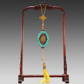 A piece of Qing Dynasty silver gilt inlaid green pine fasting pendant