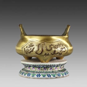 A small gilt incense burner