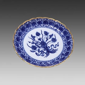 A piece of blue and white porcelain with gold and a bouquet of lotus appreciation plates