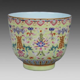 A Qing Dynasty Daoguang pastel entwined flower longevity pattern cup