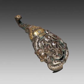 A piece of Han Dynasty copper with a hook of wrong gold and silver bear