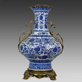 A blue and white twig lotus pattern with copper trim amphorae