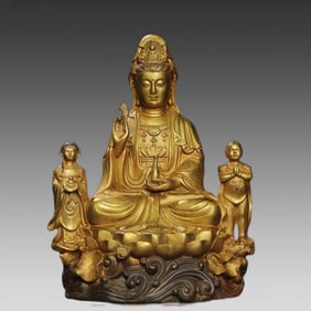 A bronze gilt statue of the golden boy and jade girl Guanyin