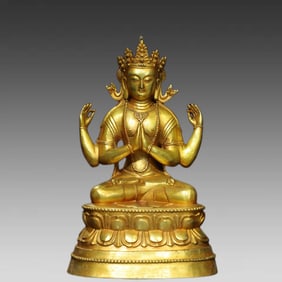 A bronze gilt four-armed Guanyin Buddha statue