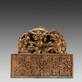A bronze gilt nine-dragon button seal