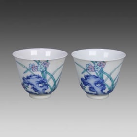 A pair of Qing Dynasty Yongzheng official kiln doucai flower cups