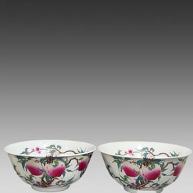 A pair of Yongzheng five blessings and eight peach bowls from the Qing Dynasty