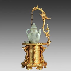 A bronze gilt relief inlay and Tian jade ornaments