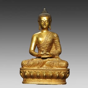 A bronze gilt statue of Shakyamuni Buddha