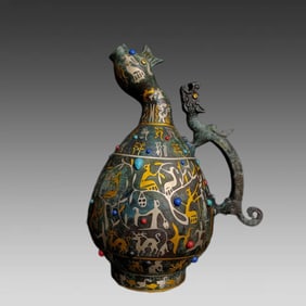 A Warring States bronze silver inlaid with gemstone handle pot