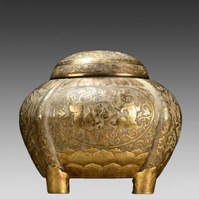 A sterling silver gilt character story tea canister