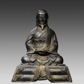 A bronze gold rubbing Guru Buddha statue