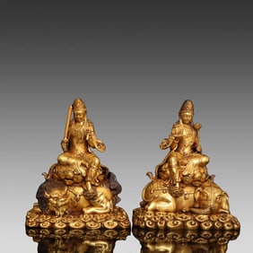 A pair of bronze gilt Manjushri ornaments