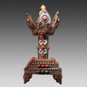A silver filigree lotus shrine