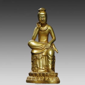 A bronze gilt statue of the Buddha of the Dharma