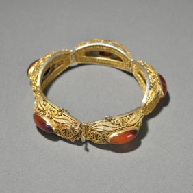A bronze gilt onyx bracelet