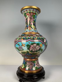 A cloisonné with green background window flower and bird pattern vase