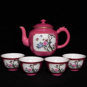 A set of carmine red ground window pastel flower butterfly pattern tea set made in the Yongzheng