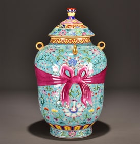 A Qing Dynasty Yongzheng enamel color crocus pattern wrapper bottle