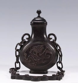 A Qing Dynasty small-leaved red sandalwood with chain appreciation bottle