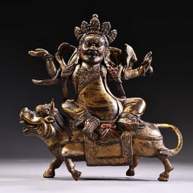 A bronze and gold Tibetan Dharma Protector Buddha statue