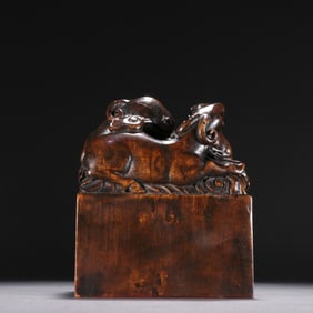A piece of Qing Dynasty sandalwood three sheep open Thai button seal