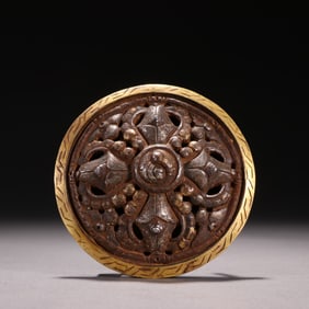 A copper-gilt patterned belt buckle