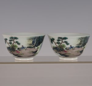 A pair of pastel landscape character story cups made in the Yongzheng year of the Qing Dynasty
