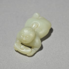 A Hetian jade beckoning boy carving