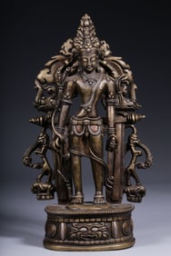 A Qing Dynasty alloy copper inlaid silver holding lotus Guanyin statue